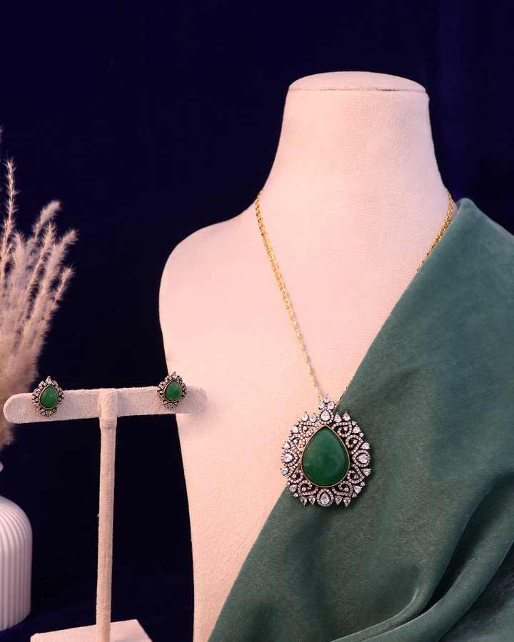 Emerald Green Stone Set on Dusty Teal Velvet