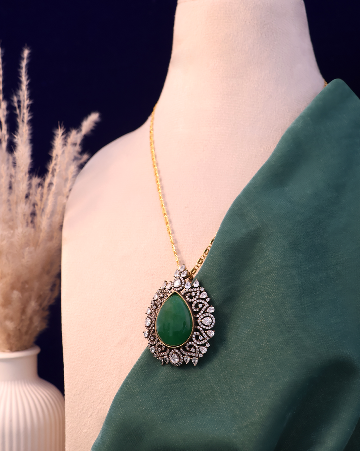 Emerald Green Stone Set on Dusty Teal Velvet