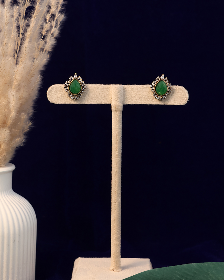 Emerald Green Stone Set on Dusty Teal Velvet